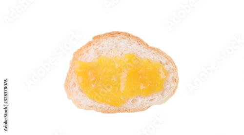 Sliced of sourdough Loaf with mango jam on top isolated on white background