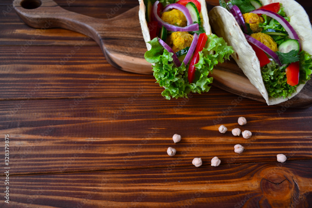 Mexican tacos with vegetables and falafel. Mexican tacos with vegetables and falafel.