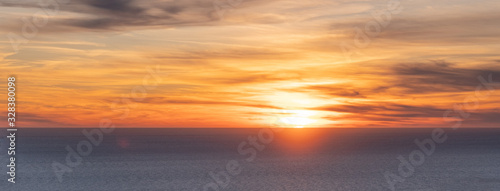 Colorful sunset at sea. Beautiful cloudscape © IrinaK