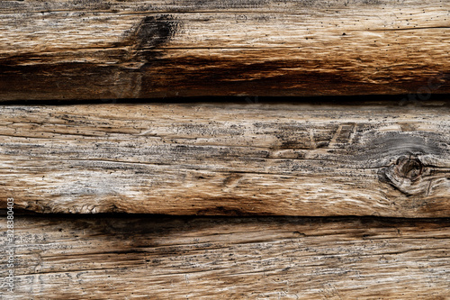 Texture od wooden planks. Wall made of antique wood. Raw wood after century.