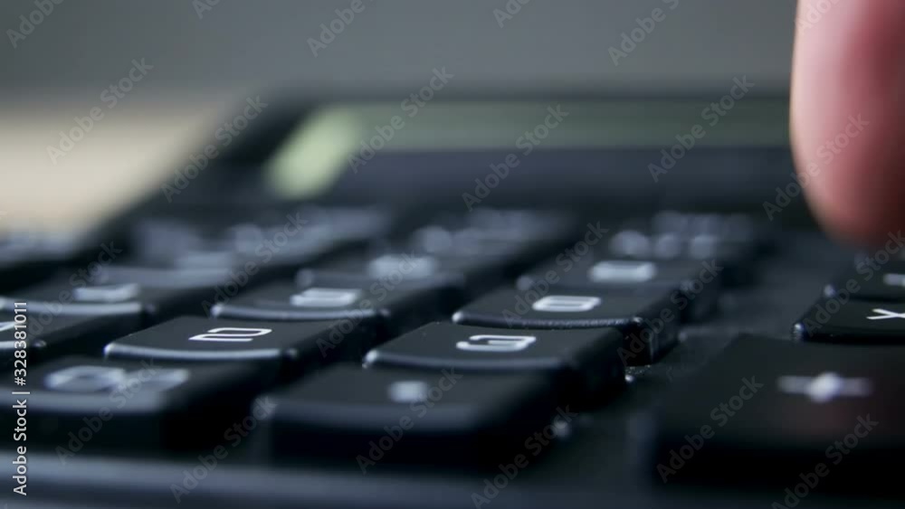Video of accountant hand using a classic financial calculator and pressing keys to compute numbers. Family budget. Savings, finances and economy concept Video of accountant hand using a classic financial calculator and pressing keys to compute numbers. Family budget. Savings, finances and economy concept