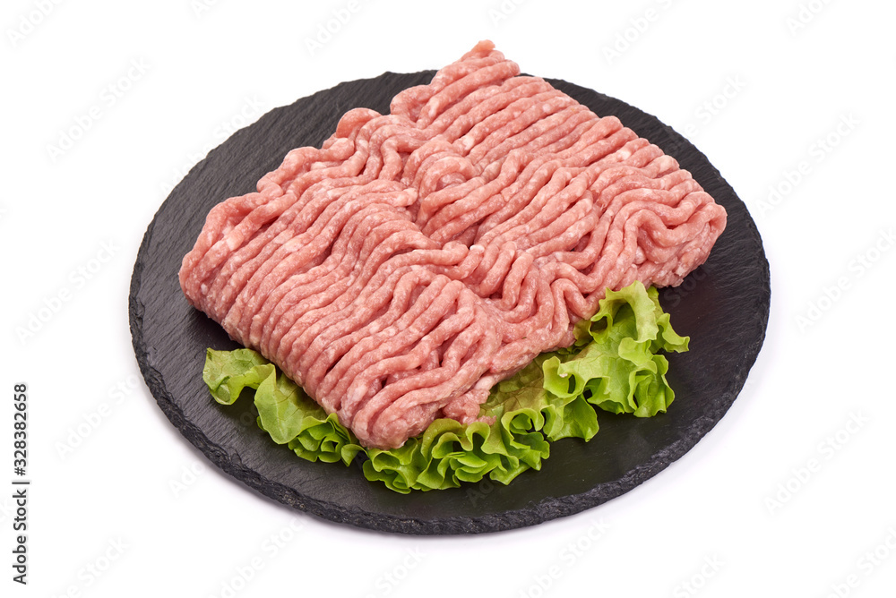 Fresh beef minced meat on a stone plate, isolated on white background Fresh beef minced meat on a stone plate, isolated on white background
