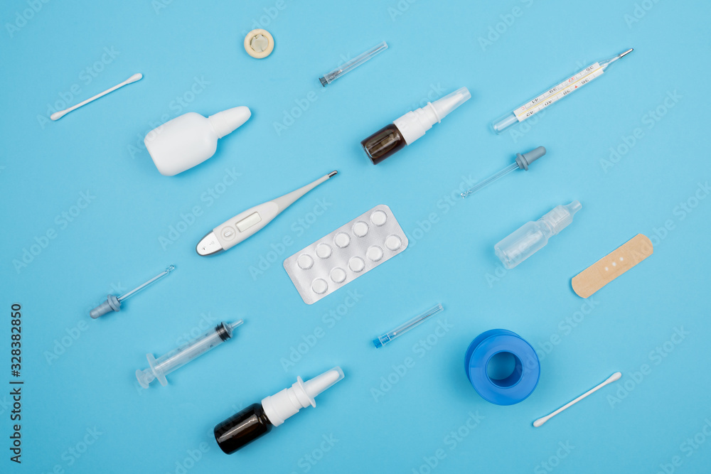 Assortment of medical supplies on a blue background. Assortment of medical supplies on a blue background.