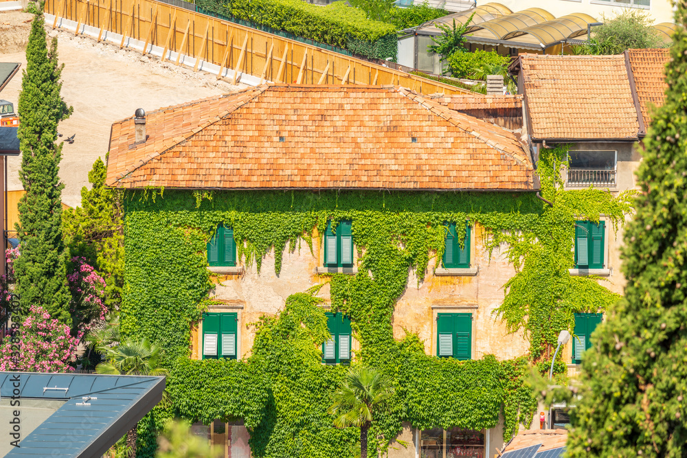 Top view to red roofs in Torbole old city, Italy.