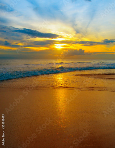Bright sunrise over the sea. The concept is travel. © alinamd