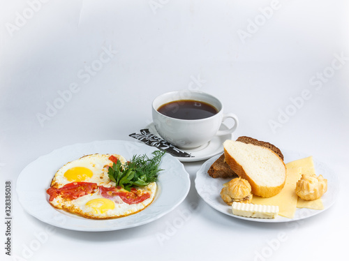 cup of coffee eggs and bread