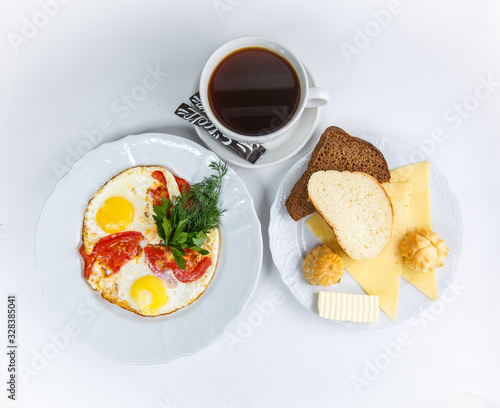 cup of coffee eggs and bread