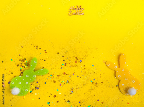 two decorative bunny on yellow background