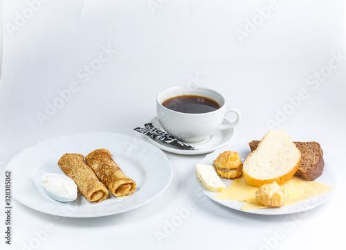 cup of coffee and croissant on a table