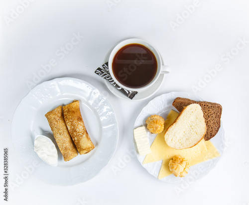cup of coffee and cake isolated on white background