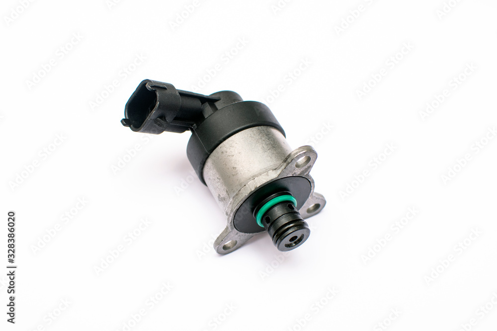 Electromagnetic metering valve of the vehicle's fuel pump on an isolated white background. Common rail control valve. Electromagnetic metering valve of the vehicle's fuel pump on an isolated white background. Common rail control valve.