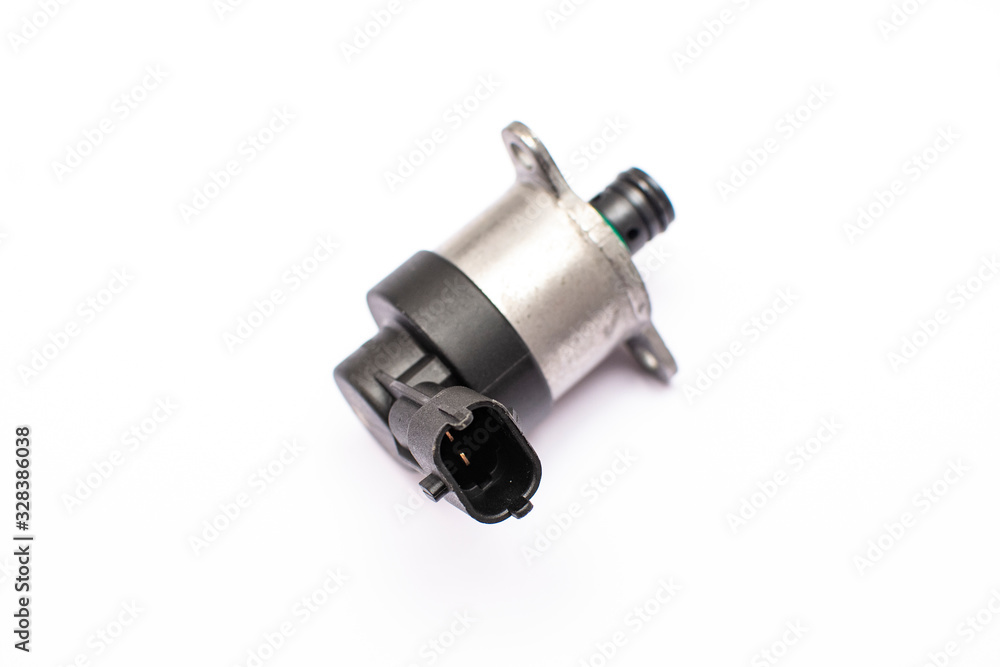 Electromagnetic metering valve of the vehicle's fuel pump on an isolated white background. Common rail control valve. Electromagnetic metering valve of the vehicle's fuel pump on an isolated white background. Common rail control valve.