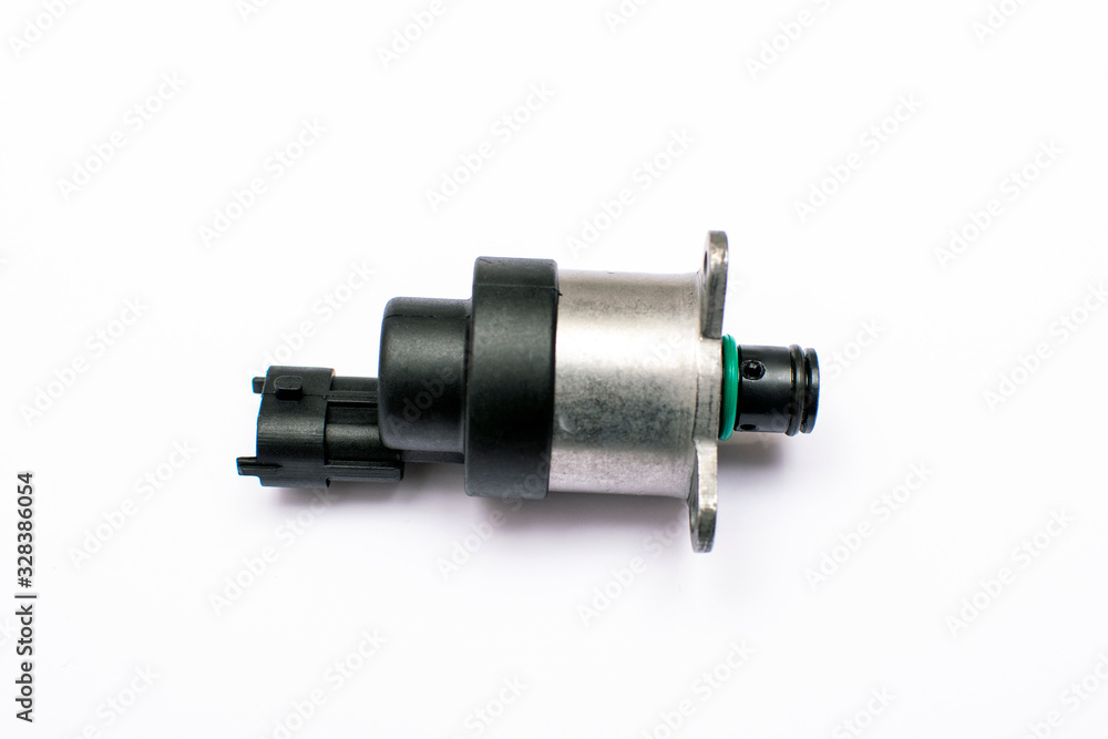 Electromagnetic metering valve of the vehicle's fuel pump on an isolated white background. Common rail control valve. Electromagnetic metering valve of the vehicle's fuel pump on an isolated white background. Common rail control valve.