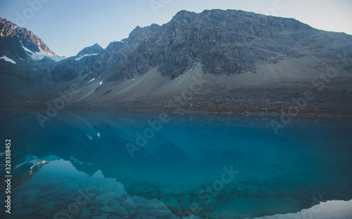 Fototapeta Naklejka Na Ścianę i Meble -  Beautiful wide view of Blavatnet - the norwegian glacial Blue Lake in Northern Norway, views of the Lyngen Alps