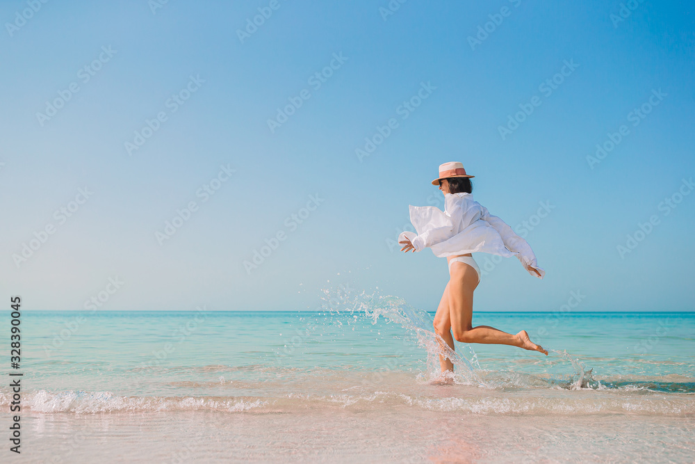 Woman laying on the beach enjoying summer holidays looking at the sea Woman laying on the beach enjoying summer holidays looking at the sea