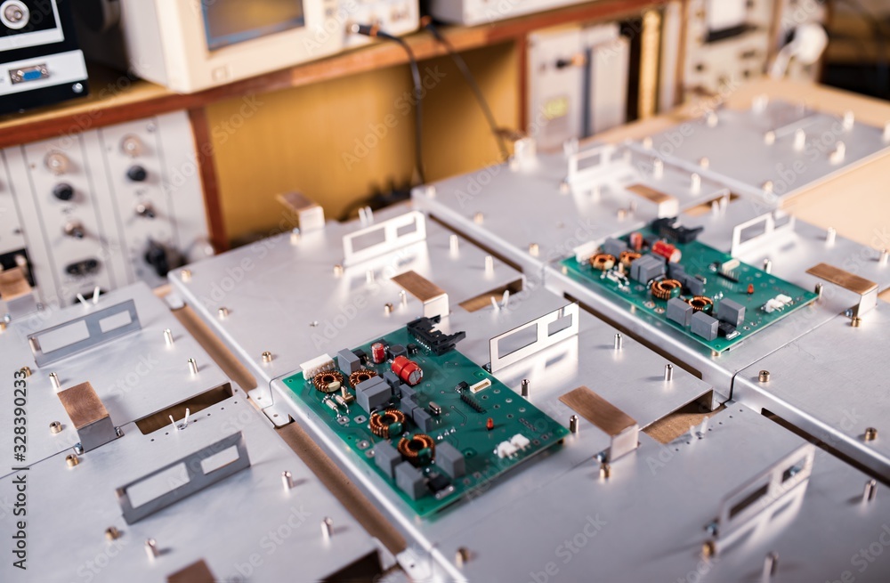 Fototapeta premium Microcircuits and components lie on metal plates
