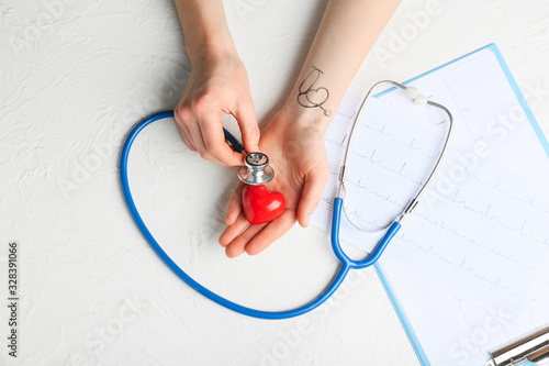 Hands of cardiologist with ...
