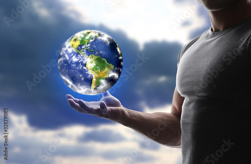 Man holding model of Earth ...