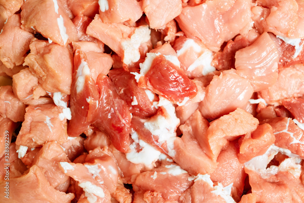 Raw meat cut into small pieces. Meat background Raw meat cut into small pieces. Meat background