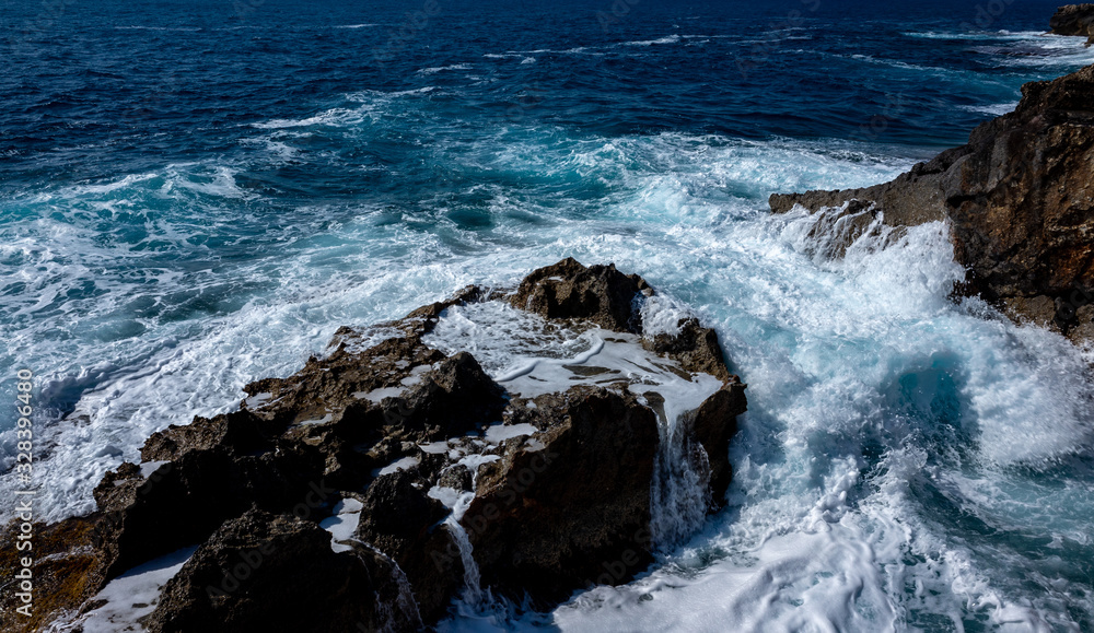 Waves crash on the rocky shore of the Mediterranean Sea on the Akamas Peninsula in the northwest of the island of Cyprus. Waves crash on the rocky shore of the Mediterranean Sea on the Akamas Peninsula in the northwest of the island of Cyprus.
