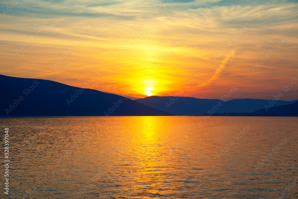 Obraz premium sunset over the and beautiful clouds