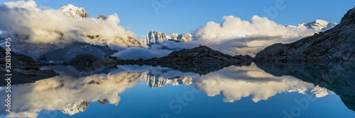 Foto reflexion of mountain on water; sunset from lac blanc over chamonix