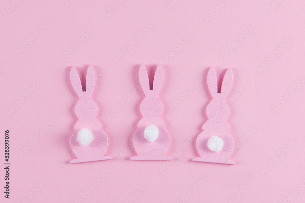 Pink Easter bunnies on pink background, easter greeting card, top view