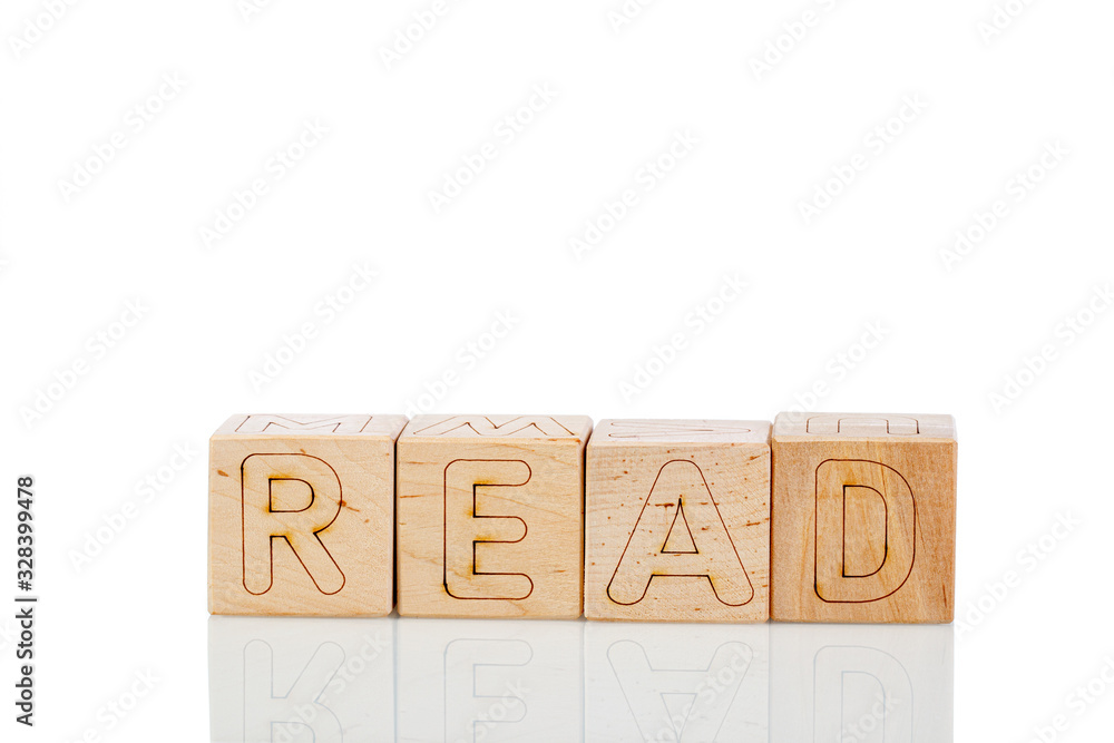 Wooden cubes with letters read on a white background