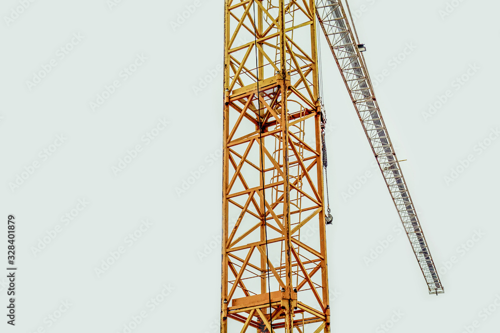 Building crane on sky background. Silhouette of industrial lifting equipment in construction site Building crane on sky background. Silhouette of industrial lifting equipment in construction site