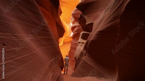 Antelope Canyon Dolly Shot Man standing in Slot Canyon in Arizona R Southwest USA