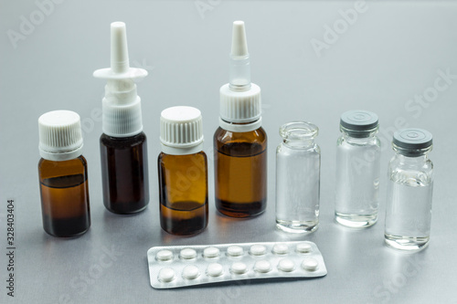 Glass Bottle with medicines. Pills to treat colds. Medical concepts and medicines.