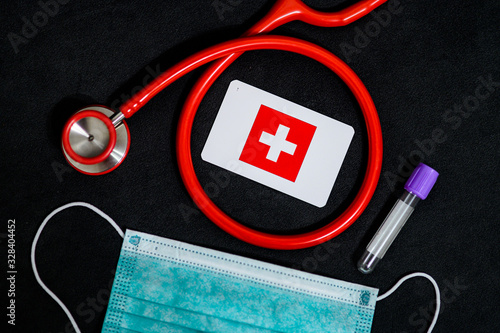 Coronavirus in Switzerland, Europe, surgical mask with coronavirus, Respiratory, test tube and Switzerland flag photo