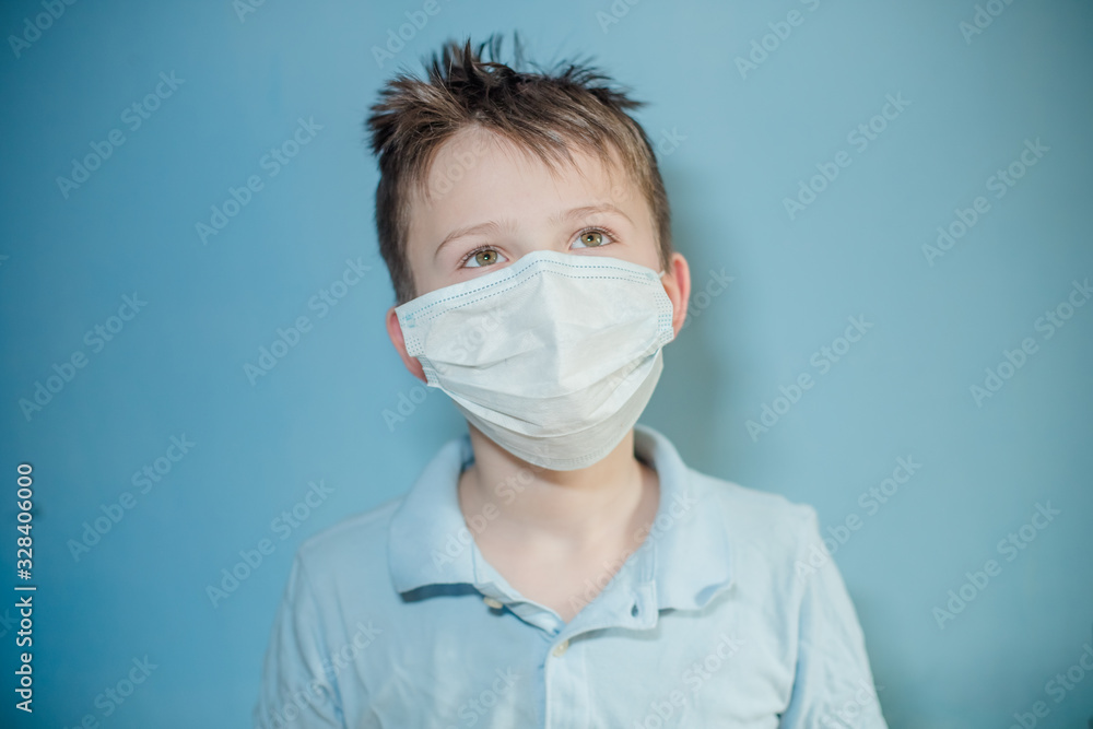 Masked child during COVID-19 quarantine. Ukrainian boy wearing protective mask epidemic Coronavirus Wuhan, Child protects PM 2.5 dust and air pollution or respiratory virus. Masked child during COVID-19 quarantine. Ukrainian boy wearing protective mask epidemic Coronavirus Wuhan, Child protects PM 2.5 dust and air pollution or respiratory virus.