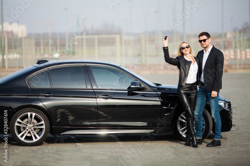 Happy young couple chooses and buying a new car for the family. © Maksymiv Iurii