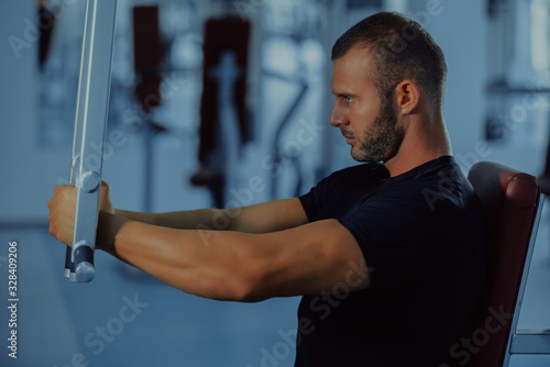 sport, bodybuilding, lifestyle and people concept - young man with barbell flexing muscles and making shoulder and chest press lunge in gym © fotoinfot