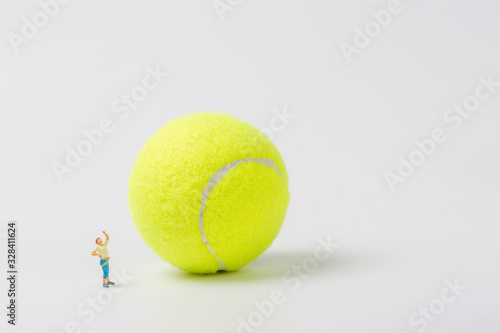 Man climbing tennis on white background © Jianyi Liu 
