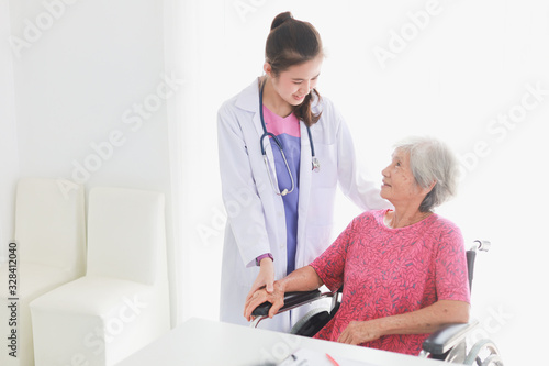Asian Old Patient woman  Talking with Medical Doctor women in clinic office hospital