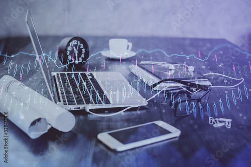 Forex Chart hologram on table with computer background. Double exposure. Concept of financial markets.