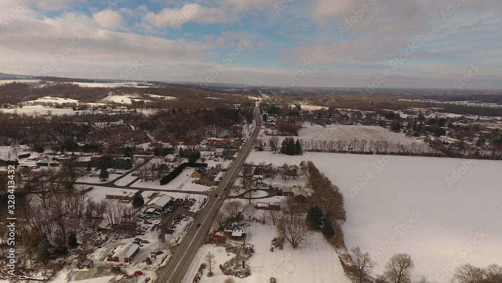 Aerial view of snow covered road and countryside Aerial view of snow covered road and countryside