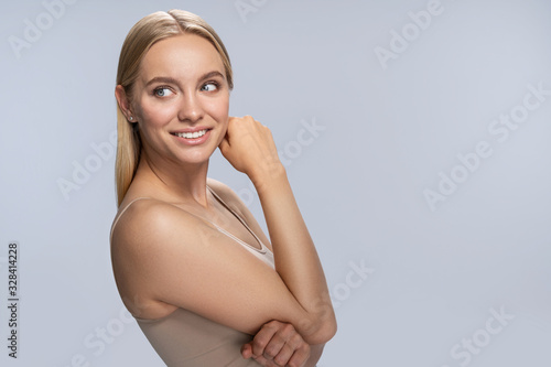 Girl with her arms folded looking aside