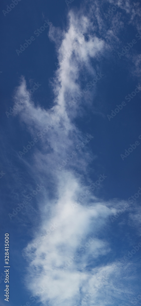 Fototapeta premium Blue sky with white clouds, natural backgrounds, vertical photo