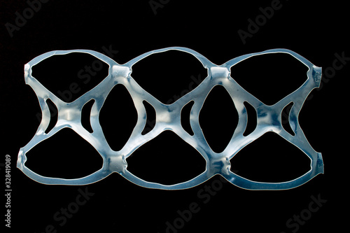 фотография Six pack rings or six pack yokes are a set of connected plastic rings that are u