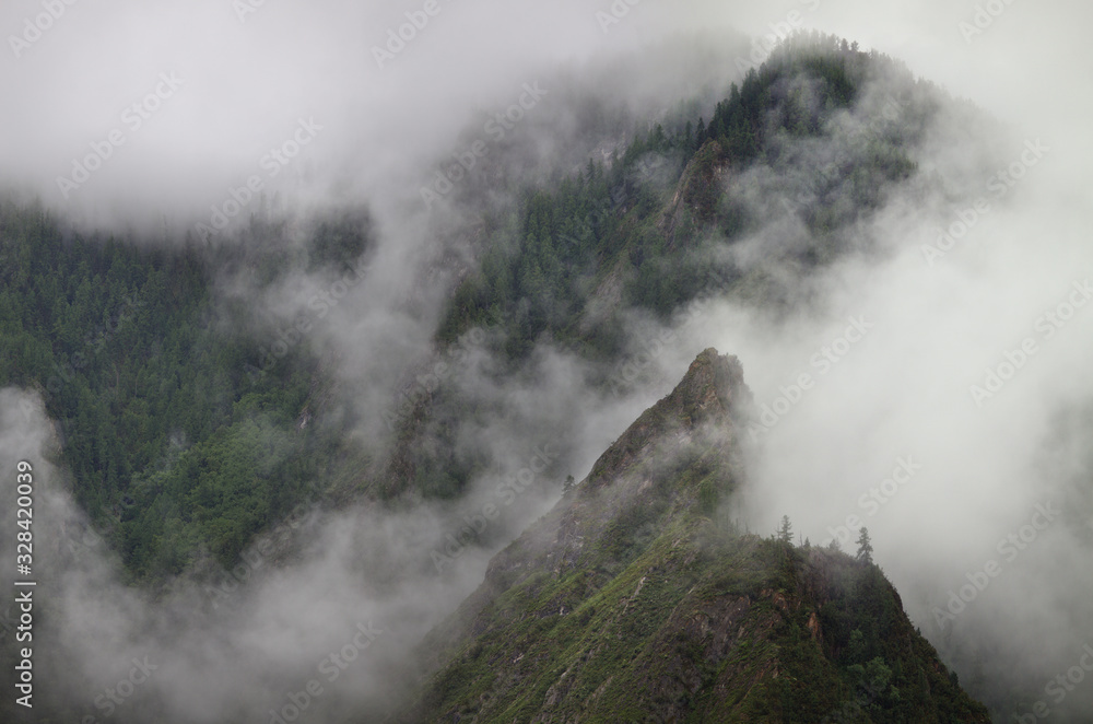 Mountain peaks in the clouds, natural background