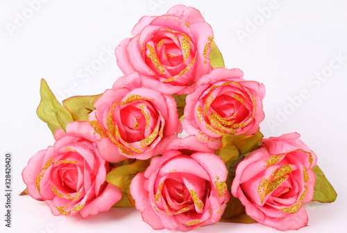 Close up Pink textile rose on white background