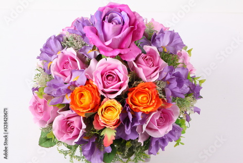 Colorful flower arrangement centerpiece in square glass vase © Suwit