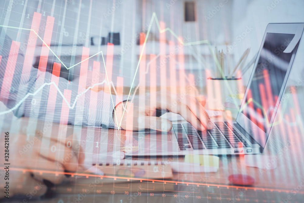Multi exposure of stock market chart with man working on computer on background. Concept of financial analysis. Multi exposure of stock market chart with man working on computer on background. Concept of financial analysis.