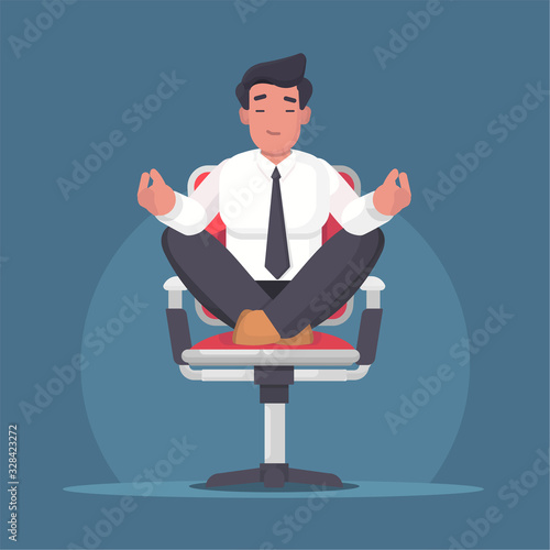 Businessman meditating and relaxing in office