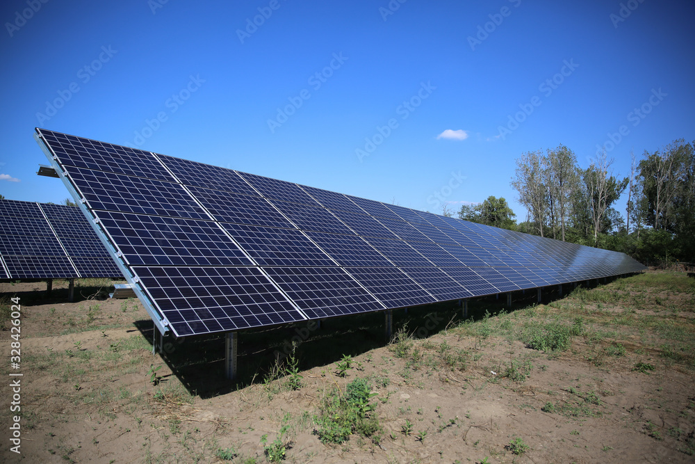 Line of solar power plant panels.