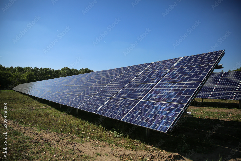 Line of solar power plant panels. Line of solar power plant panels.