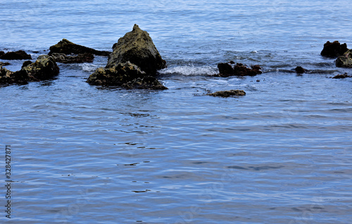 Landscape of large and small rocks in the sea.